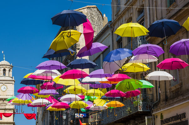 Street of Arles decorated with colored umbrellas, Provence. France - Emanuele Mazzoni Photo