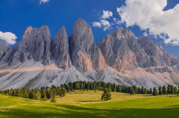 Sunny afternoon view of Odle mountain group knife-edge peaks as taken from Malga Glatsch refuge in Puez-Odle Nature park, Funes valley, Dolomites, Trentino Alto Adige, Bolzano, South Tyrol, Italy Copyright Mo